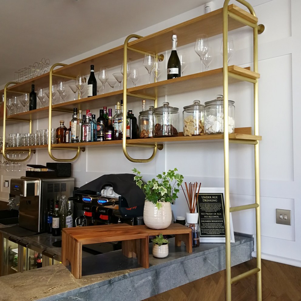 LELLO'S - RESTAURANT DESIGN | Brass & oak bar shelving | Interior Designers